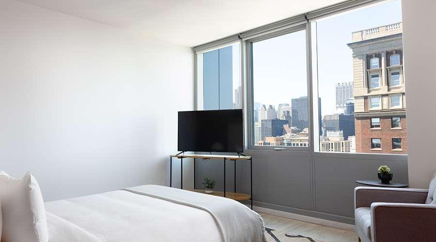 Sentral Michigan Avenue Aparthotel Чикаго Стая снимка A bedroom at 100 East 14th Street
